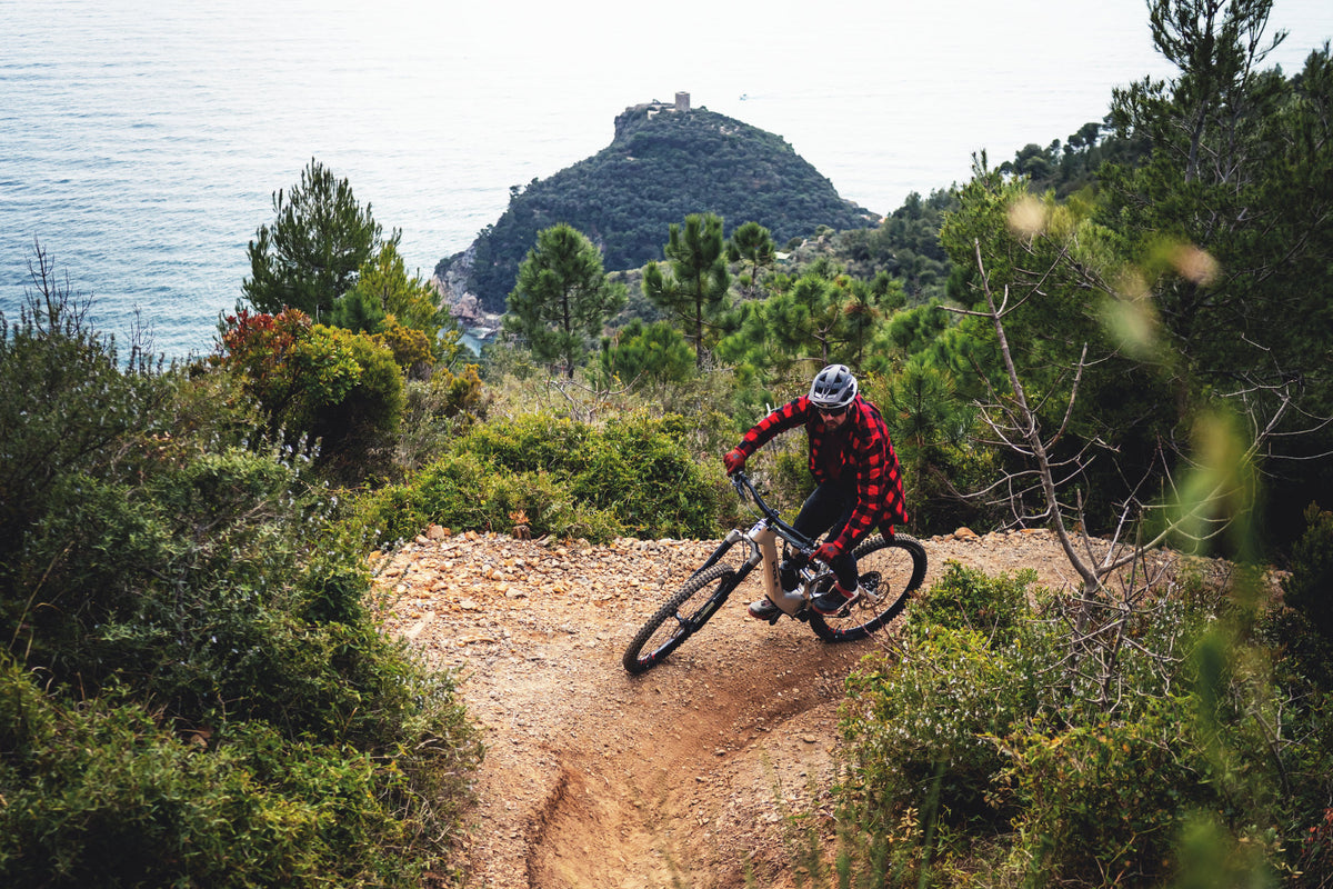 Leo Kokkonen climbing on the Pole Hiisi, DH Men trail Finale Ligure