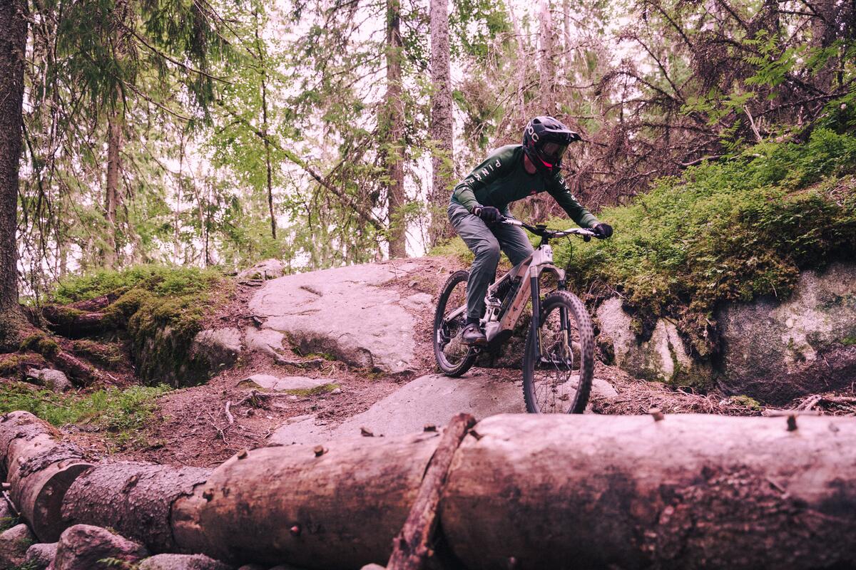 Riding the Pole Hiisi down a rocky forest trail in the Pinkbike First Ride review